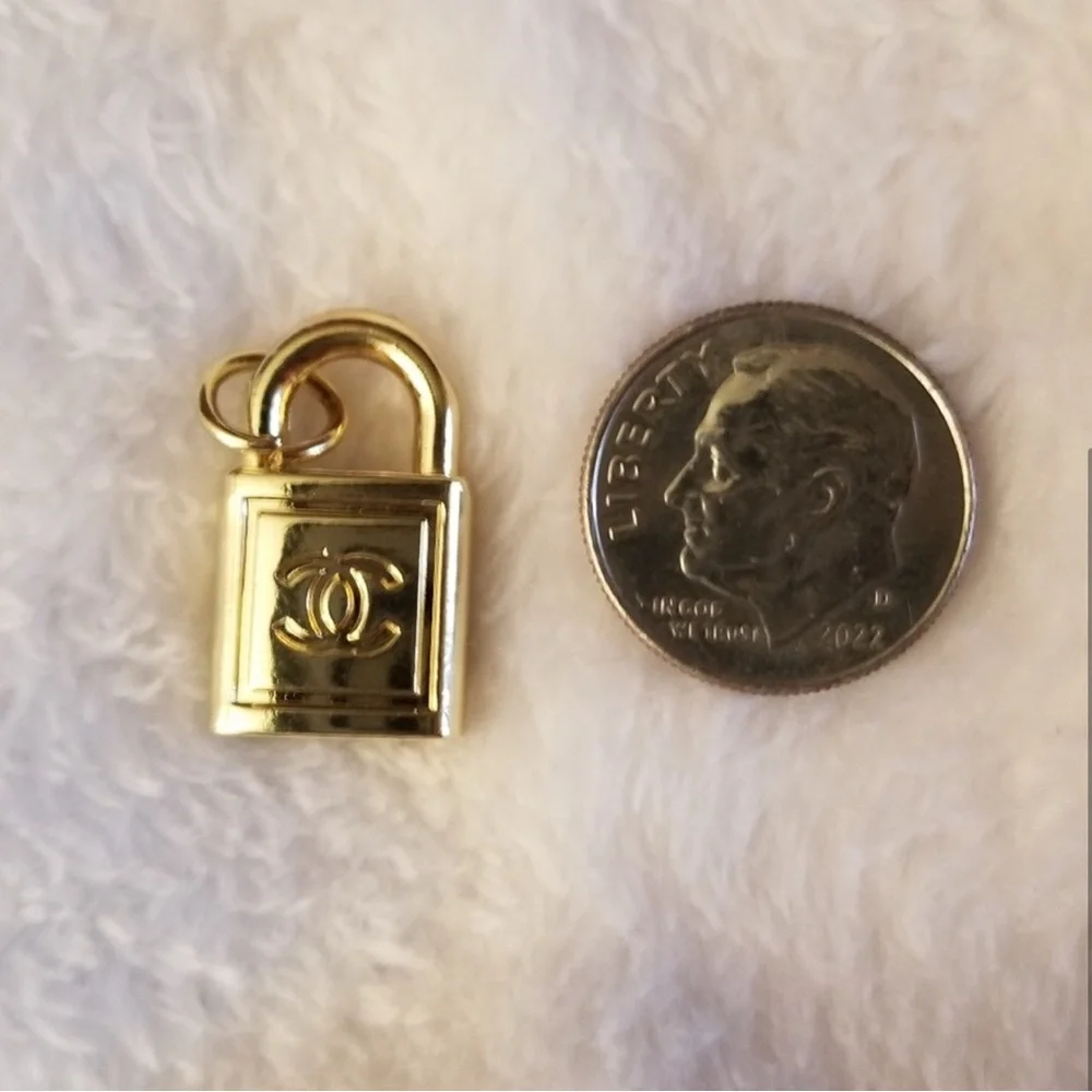 CHANEL- Gold Padlock Charm Pendant with CC Logo